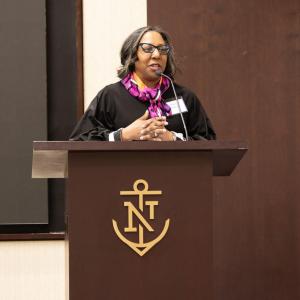 A speaker at a podium