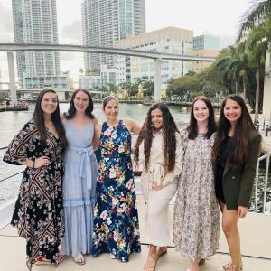 Group of people standing in front of cityscape