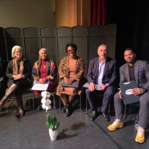 The judges for the Bank Tank competition shown seated.