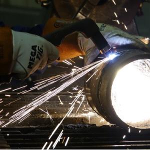 close up of a welding torch being used on a metal tube