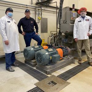 Barilla Plant Director Chris Buseman, Plant Mgr Bill Boula, National Grid Energy Efficiency Specialist Jay Snyder with die wash pump
