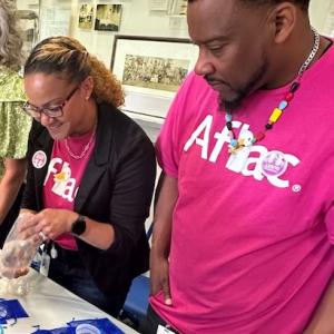 Aflac volunteers shown with the beads of courage.