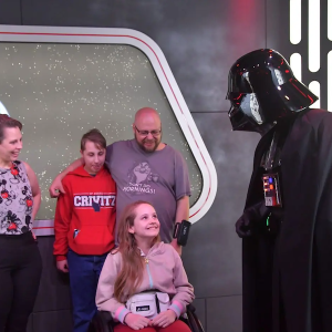 Becky and her family seeing Darth Vader at a theme park.