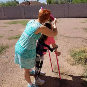 Becky and her daughter in a field.