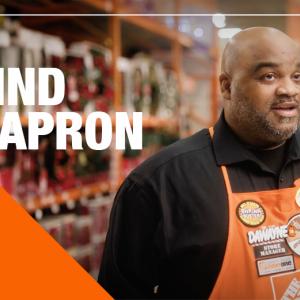 Behind the Apron: Dawayne Gates shown near a Christmas tree.