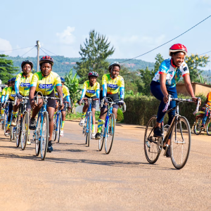 A group riding bicycles down the street