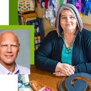 Bill Harris on the left and Katrina Mitten on the right seated at a table with award ribbons in the background.