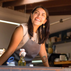 A woman in an apron.