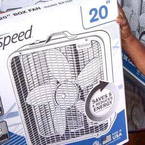 person holding fan in a box