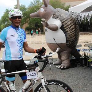 Rodric Allen from Pushin Watts shown in cycling gear and with his bike.