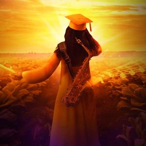 A person in graduation cap and gown, holding a rolled paper, looking out over a field of crops. The image filtered in yellow.