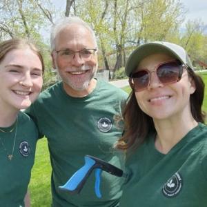 A group of people wearing green shirts