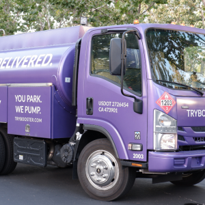 Purple Booster tanker sits in parking lot. 