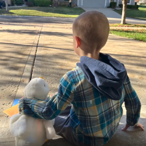 Young boy shown with My Special Aflac Duck.