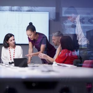 A team of people around an office table
