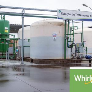 Outdoor water storage tanks and piping. Whirlpool logo in lower left corner