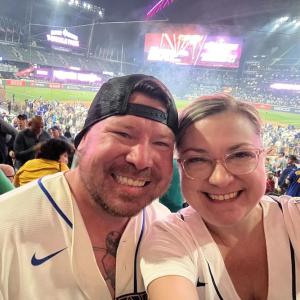 Brian Boosz and his wife at a baseball game.