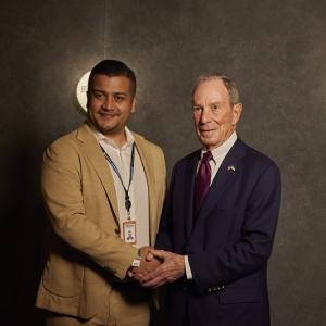 Two people shaking hands for a photo