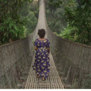 woman walking alone across a long bridge