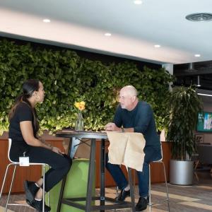 Bridgette Baldwin speaking with Mark McCaffrey of GoDaddy.