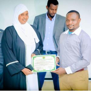 Two people holding a certificate 