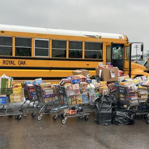 Boxes of donated cereal outside of the school bus