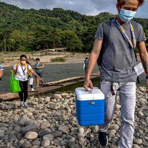 people carrying cold boxes