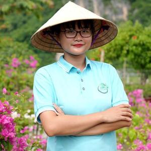 Pham Phoung Thao outside, surrounded by flowers