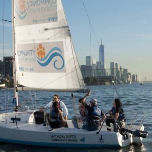 Sailboat with a Community Offshore Wind sign