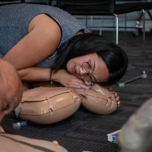 person practicing CPR
