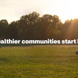 Healthier communities start here. Young person playing soccer.