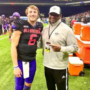 Anthony Williams standing with football player 