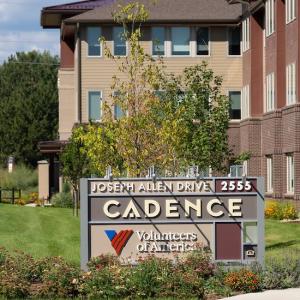 Cadence sign in front of building