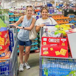 women with shopping carts