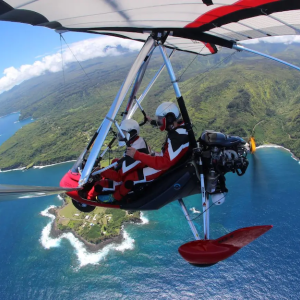 Calvin and his wife paragliding.