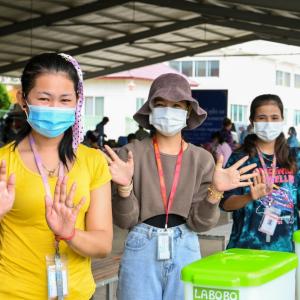 Factory workers at Sunbow factory, who are going to get their COVID-19 vaccines, wash their hands with Labobo, Kandal Stueng District in Kandal province, Cambodia, June, 2021.