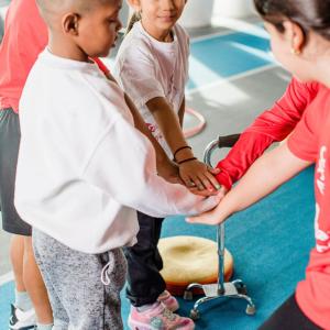 Four children holding hands.