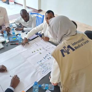 people working together on a chart