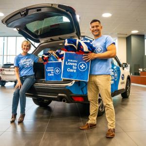 People holding up care kits
