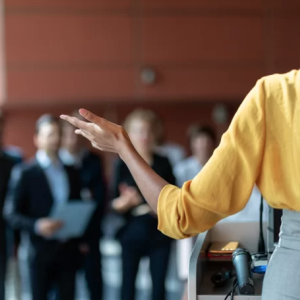 person speaking to an audience 