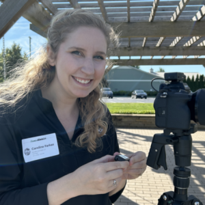 Caroline Farkas under a pergola outside