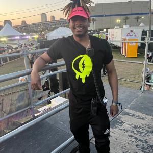 Person standing on platform, working at BUKU Music + Art Project in New Orleans