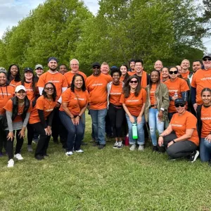 A large group of volunteers smiling 