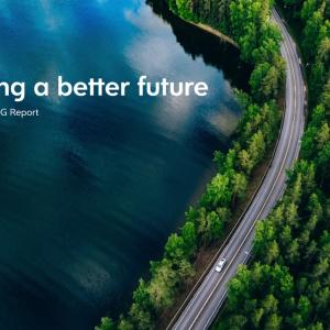 "Ceridian Building a better future 2022 Ceridian ESG Report" over a winding road through a forest