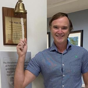 Chet Kitchen ringing a 'hope bell'.