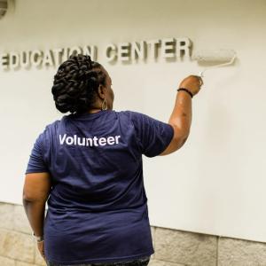 A person painting a wall