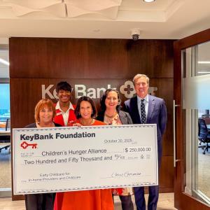 Members of the Children's Hunger Alliance and KeyBank representatives shown with a $250,000 grant check.