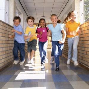 Children running in a hall.