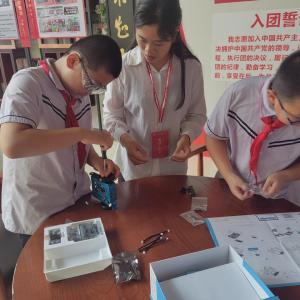Chinese STEM students work with teacher