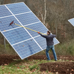 Chris Meyer cleans off the Solar panels at his home